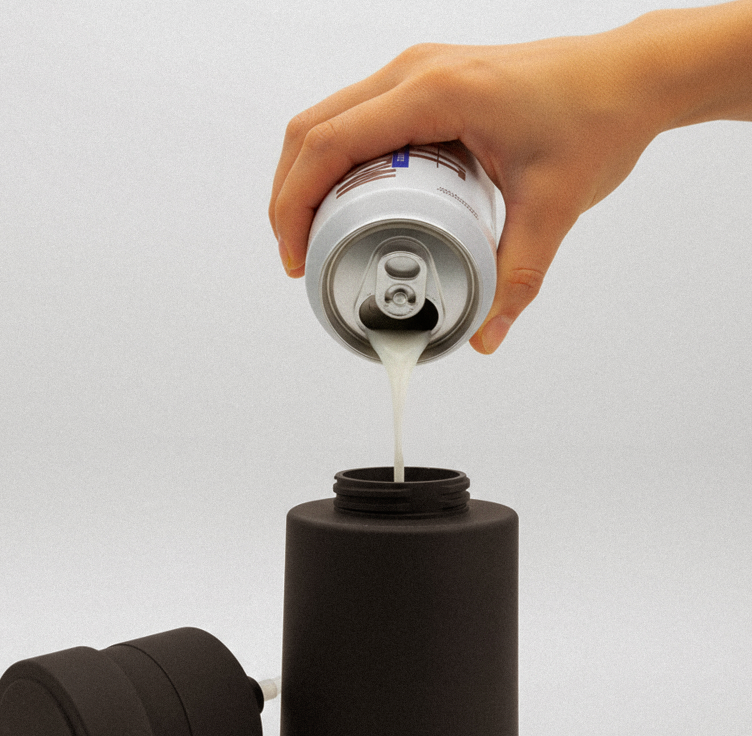 Man in a denim jacket resting his head on his hand, looking at the camera.